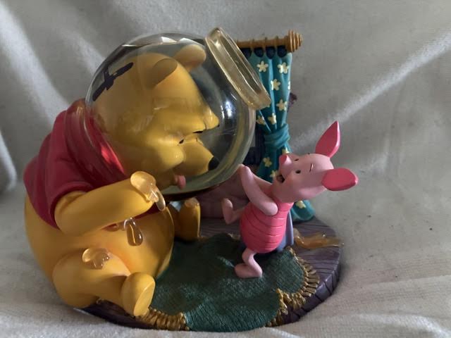 Winnie the Pooh and Piglet honey pot snow globe figurine - front view