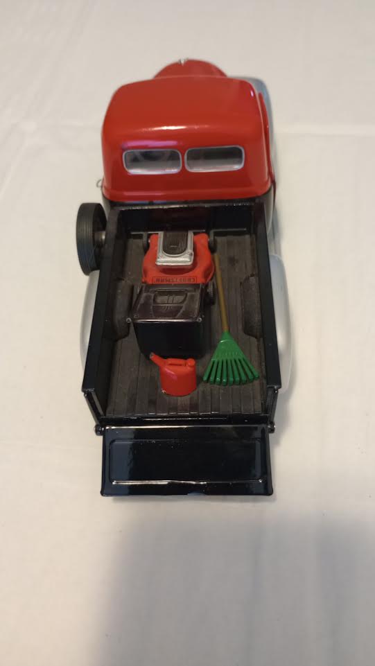 Craftsman die-cast pickup truck bed with miniature lawn mower gas can and rake
