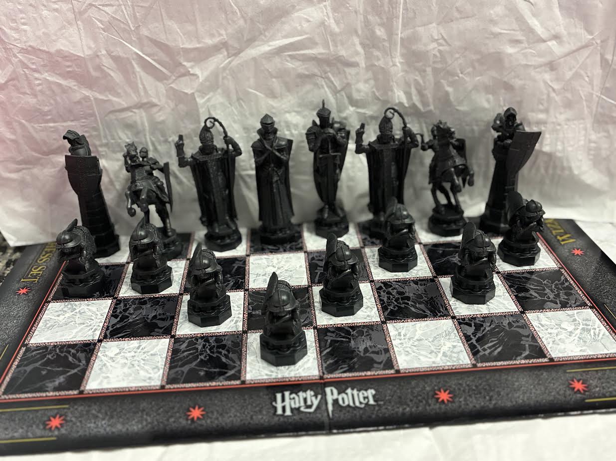 Harry Potter Wizard Chess Set black pieces on board