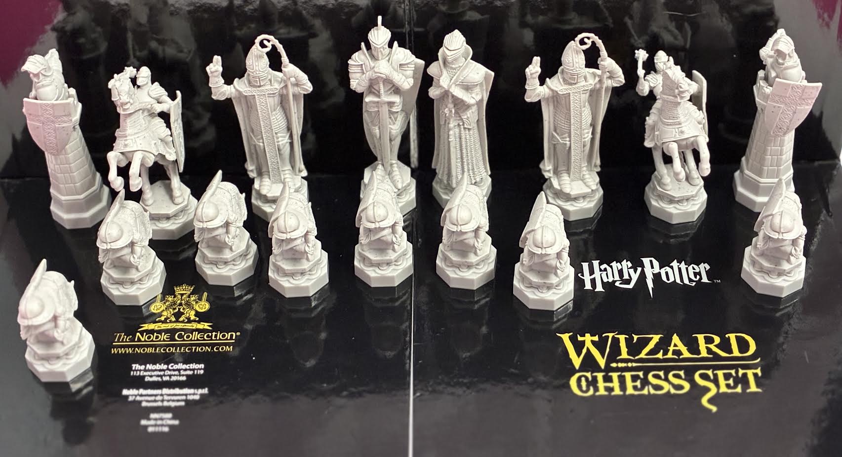 Harry Potter Wizard Chess Set white pieces on display tray