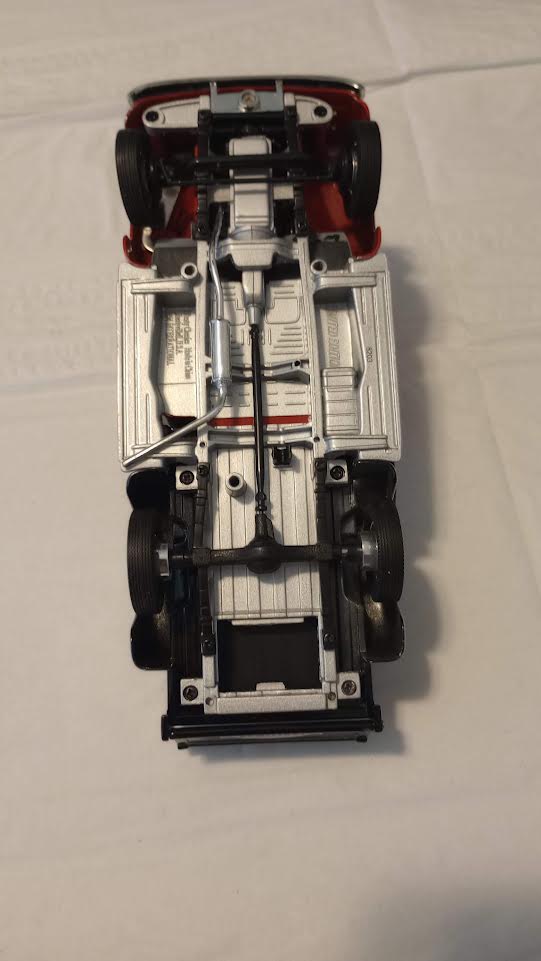 Craftsman die-cast pickup truck undercarriage showing detailed chassis and drivetrain