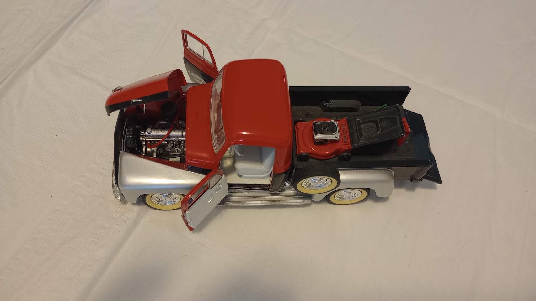 Craftsman die-cast pickup truck top view with opening hood and detailed engine