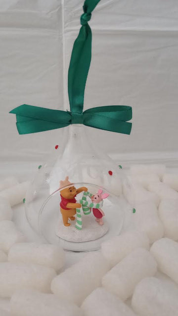 Winnie the Pooh and Piglet glass Christmas ornament front view with green ribbon