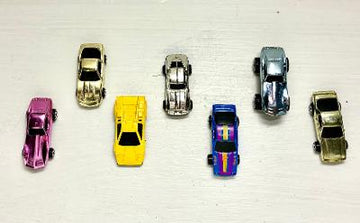 Set of 7 vintage metallic die-cast miniature cars top view