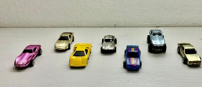 Set of 7 vintage metallic die-cast miniature cars side view