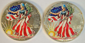 Pair of Colorized 1999 $1 American Silver Eagle coins.